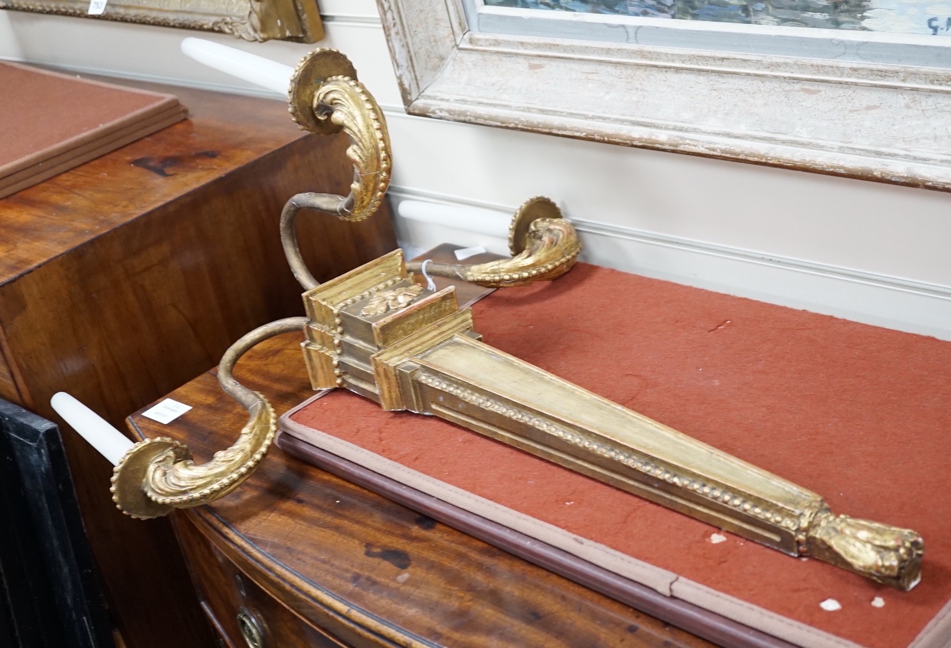 A pair of giltwood three branch wall lights, height 68cm *Please note the sale commences at 9am.